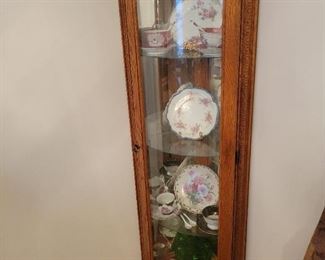 Lighted Curio has 3 glass shelves  56 inches in height 