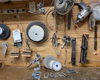 Wall of Tools: Drill, Grinding Disks, and Clamps
