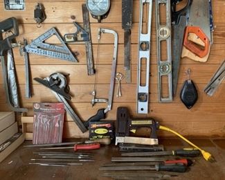 Wall of Tools: Saws, Levels, Electric Staple Gun,
Staples and Files
