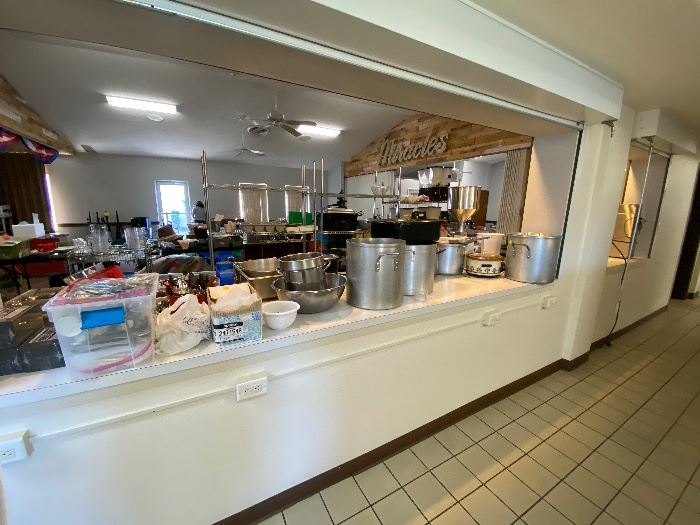 Various commercial kitchen pots and pans and appliances