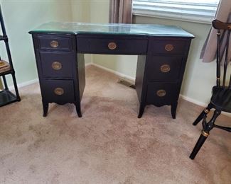 Knee-hole desk with a glass top