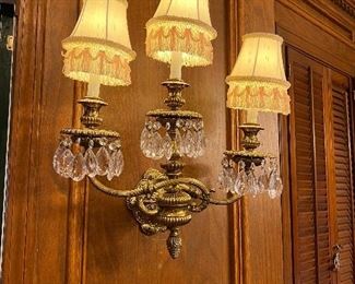 One of pair of crystal lighted wall sconces