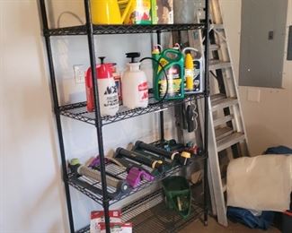 Shelving and lawn supplies, ladders