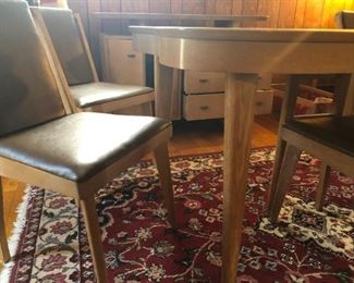 Wood Table Seats Six (seats 8 with 12" extension). Table is 52"W x 36"D x 30"H.  Six Matching Chairs are each 33"H x 18"D x 18"W