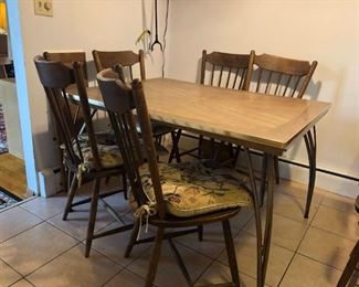 Metal Dining Room Table is 36"D x 48"W x 29"H. It includes six padded wood chairs (like new) - high backs each 38"H. There is also a 12" extension