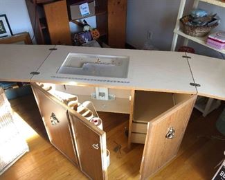 Bernina 1230 Sewing Cabinet (Multi functional).  Desk is 42"W with expansion sleeves you add additional 42"W.  Is is also 20"D and 31"H. Desk is easy to transport because it is on rollers.