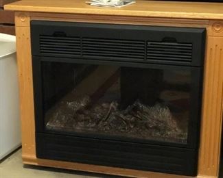 Heat  Surge electric fireplace is 31"W x 25"H x 12"D
