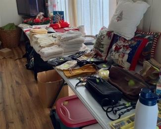 Assorted Christmas items, Linens, and Household goods.