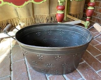 $18 - LOT 16 - Fleur-de-lis metal beverage bucket with wooden handles. 22.5 inches long from handle to handle, 12 inches wide, 10 inches tall. 