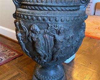 $95 - LOT 34 - Figural concrete urn. 19 inches high, 14 inches wide. 