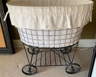 $45 - LOT 39 - Laundry cart. 25 inches long, 16 inches deep, 27 inches tall.
