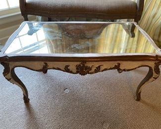 $125 - LOT 54 - Mirrored coffee table. 17 inches tall, 37.5 inches long, 20.5 inches deep.