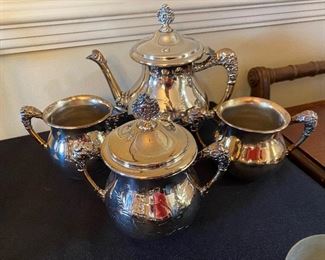$25 - LOT 62 - 4 piece tea set, quadruple plate, Warren Silver Plate Company. Tea pot and lid need repair.