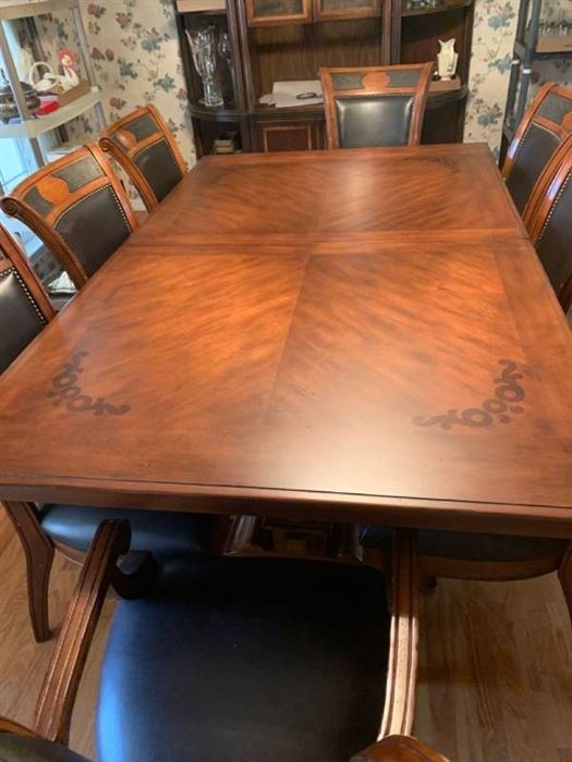 Wood dining table 78 X 48 with 8 leather and wood chairs and 24 inch leaf and table protector pads (matches lot 1001)