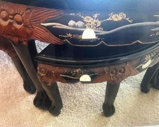 Asian coffee table and stools. Decorated with mother of pearls and other semi precious stones.