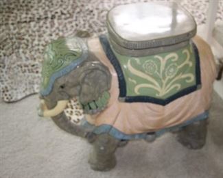 Large ceramic elephant, can be used as a plant stand or decorative table.
