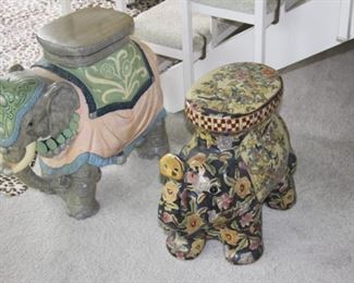 Large ceramic elephants, can be used as plant stands or decorative tables.