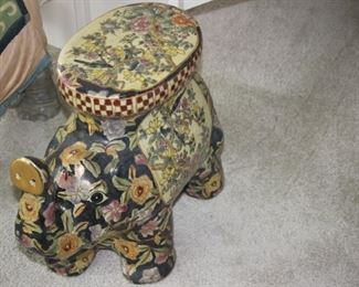 Large ceramic elephant, can be used as a plant stand or decorative table.