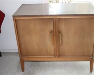 Mid century cabinet with drawers and shelves.