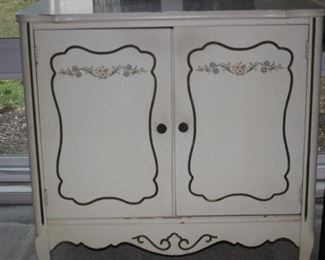 Decorative cabinet with shelves.