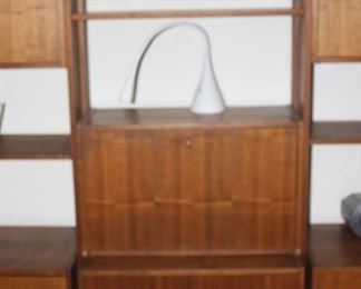 Mid century wall shelves with drop down writing desk, drawers and cabinets.