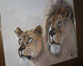 Lion and lioness framed artwork.