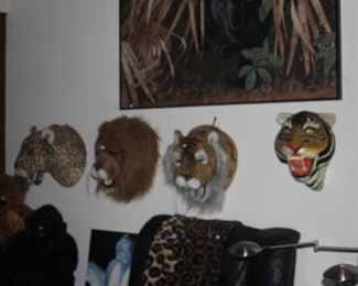 Faux stuffed animal heads and paper mache  tiger mask. 