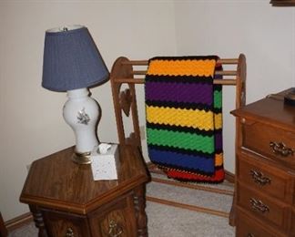 quilt rack, side table, lamp
