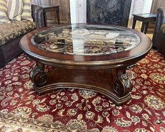 Ornate coffee table. Also pictured large area rug