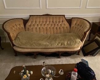 Turn of the Century sofa with ornately carved mahogany frame. Original upholstery. $400