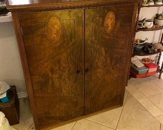 Late 1800's small armoire with storage, Solid walnut with burling and carved design $299