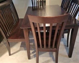 7 PIECE CASUAL DINING SET INCLUDES TABLE WITH BUTTERFLY LEAF, 4 SIDE CHAIRS & 1 BENCH WITH BACK.