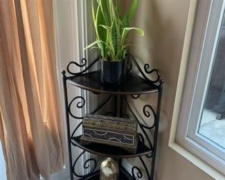 The corner stand sold. The items on it are still available. 