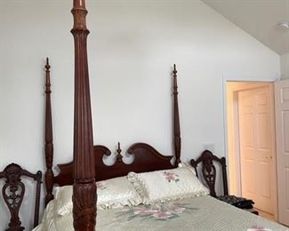 PRICE - $550; Mahogany rice-carved queen poster bedframe (does NOT include mattresses or linens); 54" wide x 88" (from headboard to footboard) x 88" (from floor to finial top).
