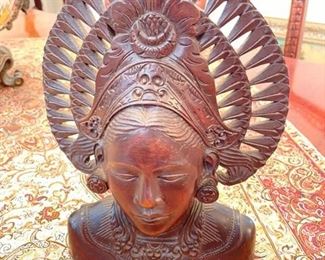 PRICE - $175 each; Indian woman carved in wood; 8" wide x 11" high.