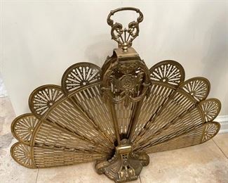 PRICE - $85; brass expandible fan fire screen; 37" fully extended width x 28" high.