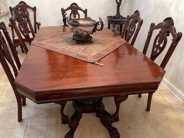 PRICE - $2,400/all; Gorgeous antique mahogany dining table with set/8 heavily carved Chippendale chairs (two arm/6 side) and 2 leaves; table measures 82" long (without leaves) x 48" wide.