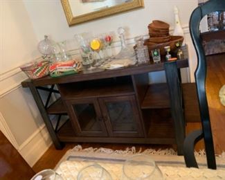 Entertainment center used as bar, hand painted wine glasses, crystal decanters
