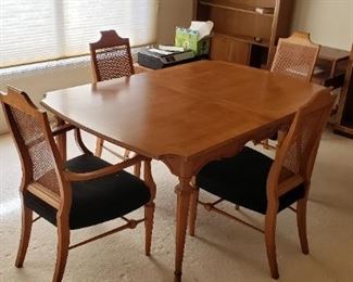 Mid-Century Modern 10pc Heritage Dining Set. Includes table, 2 leaf extensions, 5 dining chairs, 2 captain's chairs. Table dimensions: 64.5"L x 42"W x 29"H (without leaf). Each leaf (2) dimensions: 42" x 18". Available for pre-sale. For more information, please contact us at contactmvp@moorevaluepros.com
