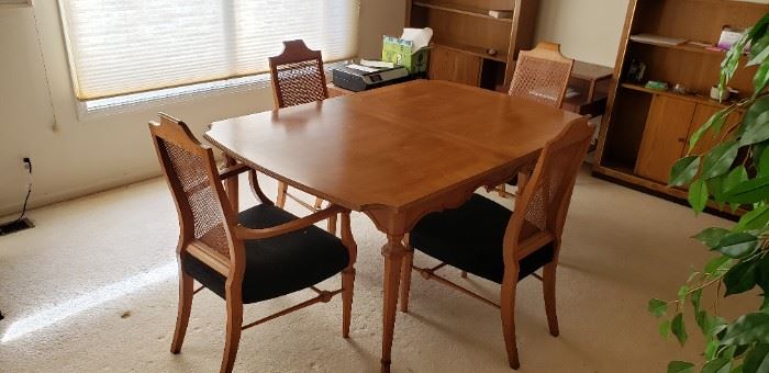 Mid-Century Modern 10pc Heritage Dining Set.  Includes table, 2 leaf extensions, 5 dining chairs, 2 captain's chairs.   Table dimensions: 64.5"L x 42"W x 29"H (without leaf). Each leaf  (2) dimensions: 42" x 18".  Available for pre-sale. For more information, please contact us at contactmvp@moorevaluepros.com