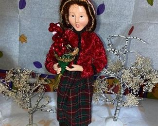 Dept. 56 two trees and woman, paint missing from berries on plant in her hand $10.00