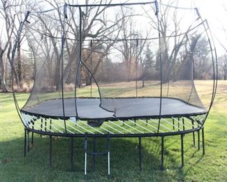 Springfree Trampoline 13' x 13' with safety netting.