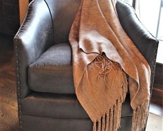 Arhaus Leather Swivel Club Chair.                             Measures  32" D x 27" W x 31" H.