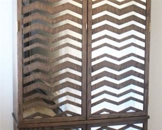 Mirrored Wardrobe/Cabinet  by Mr. Brown London.  Measures: 45 1/2" W x 17" D x 93" H.                                      Note: This cabinet is located at another home nearby. If interested, please talk to Jan to make an appointment to view this piece.