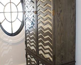 Mirrored Wardrobe/Cabinet  by Mr. Brown London.  Measures: 45 1/2" W x 17" D x 93" H.                                      Note: This cabinet is located at another home nearby. If interested, please talk to Jan to make an appointment to view this piece.