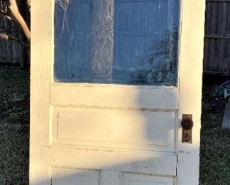 ANTIQUE SOLID WOOD DOOR WITH LARGE GLASS PANEL.