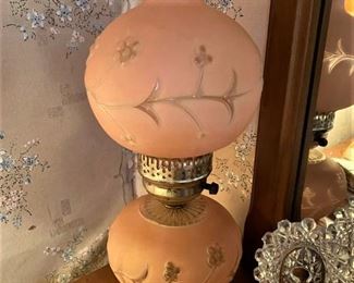 ONE OF TWO MATCHING ANTIQUE PINK LAMPS.