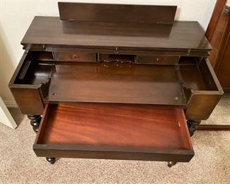 UNIQUE ANTIQUE DESK WITH INK WELL AND SECRET COMPARTMENTS.