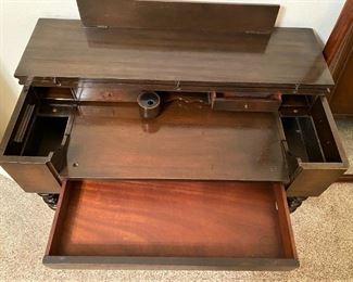 UNIQUE ANTIQUE DESK WITH INK WELL AND SECRET COMPARTMENTS.