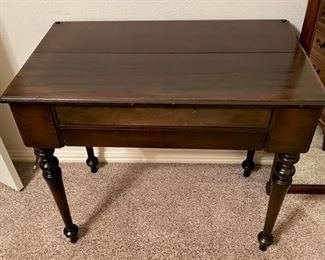 UNIQUE ANTIQUE DESK WITH INK WELL AND SECRET COMPARTMENTS.